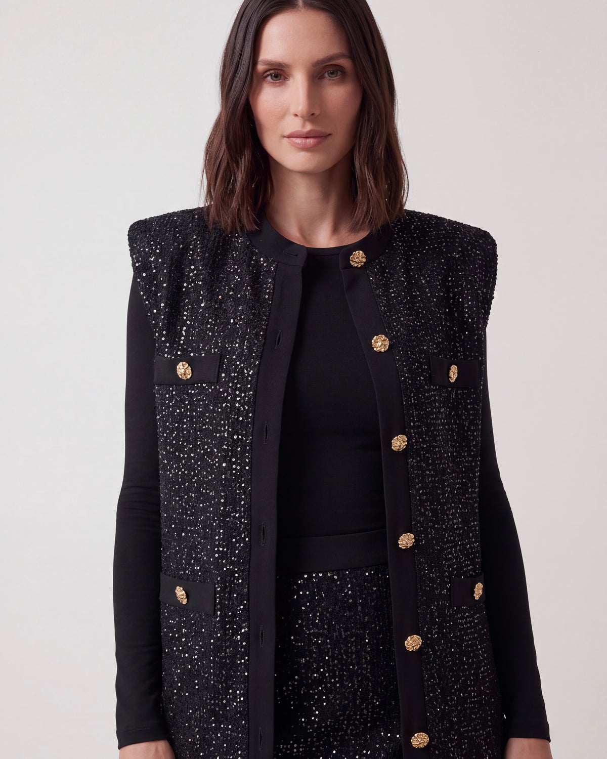 GILET LUNGO NERO IN MAGLIA LUREX CON BOTTONI GIOIELLO