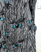 ABITO ASAN OCCHI DI GATTO